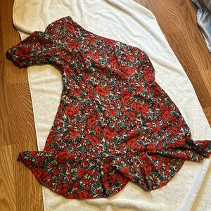 Off the shoulder, one sleeve short dress with red flowers and green leaves
